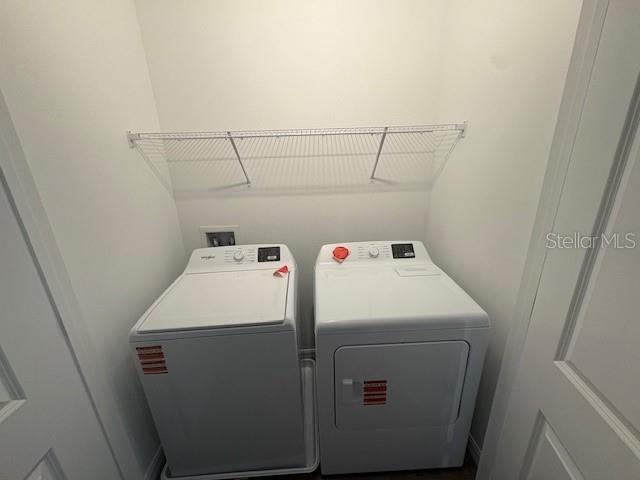 32547 Welling Blade Loop Wesley Chapel, FL 33545 - Photo 18 of 21 a utility room with dryer and washer