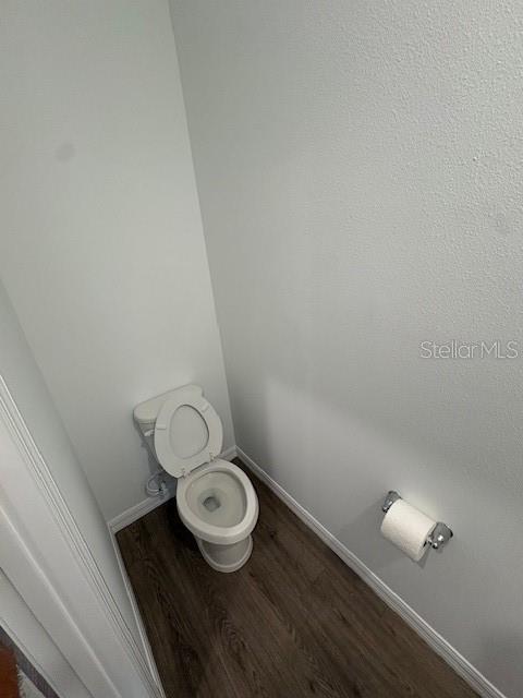 32547 Welling Blade Loop Wesley Chapel, FL 33545 - Photo 7 of 21 a bathroom with a granite countertop toilet and a sink