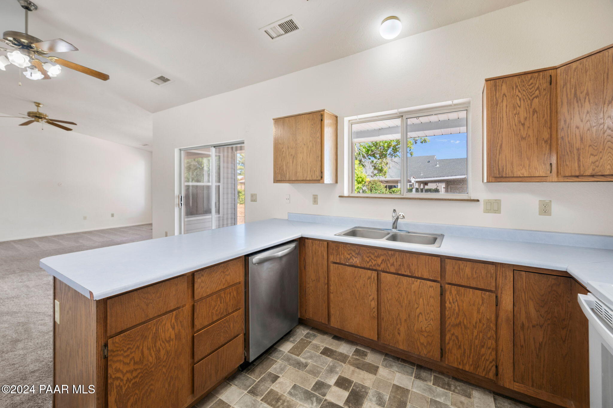 8128 East Gale Road Prescott Valley, AZ 86314 - Photo 14 of 38 a kitchen with a sink stove and microwave