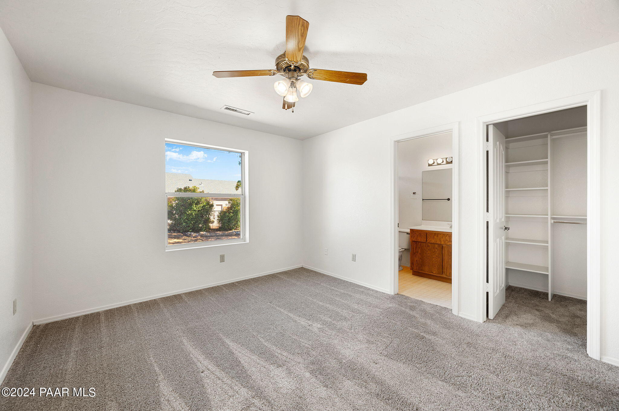 8128 East Gale Road Prescott Valley, AZ 86314 - Photo 19 of 38 an empty room with a window and chandelier