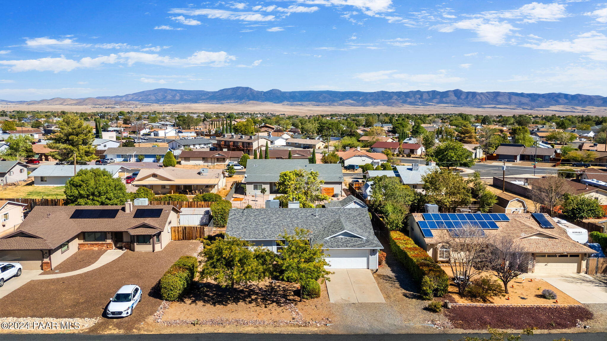 8128 East Gale Road Prescott Valley, AZ 86314 - Photo 2 of 38 a view of a city with lots of residential buildings and mountain view in back