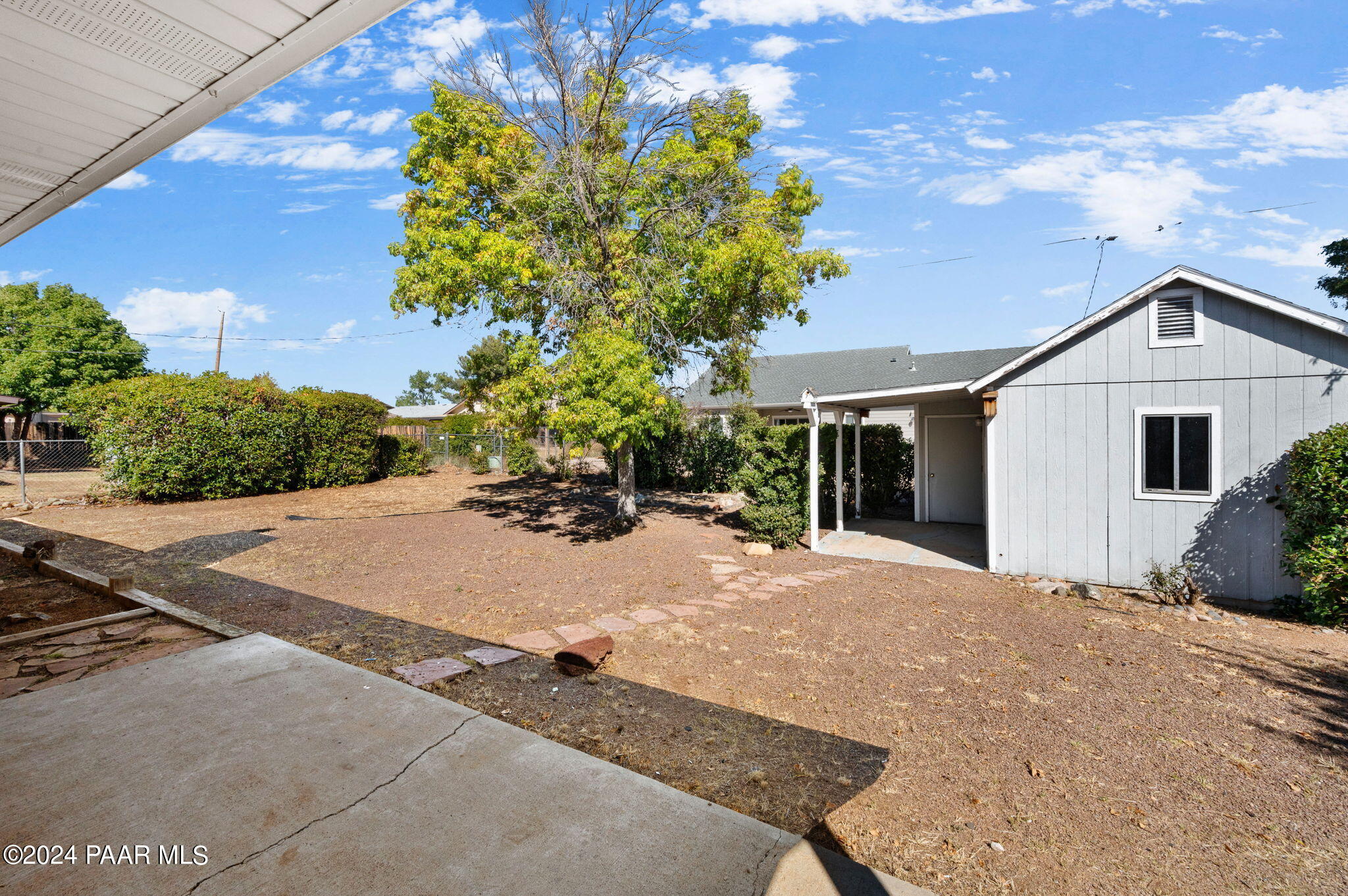 8128 East Gale Road Prescott Valley, AZ 86314 - Photo 31 of 38 a front view of a house with a yard and garage