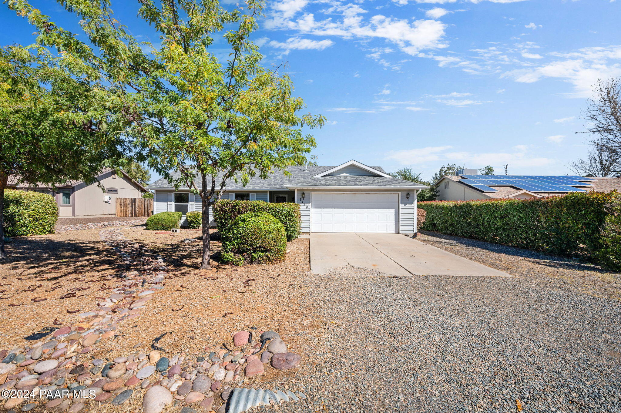 8128 East Gale Road Prescott Valley, AZ 86314 - Photo 5 of 38 a front view of a house with a yard and garage