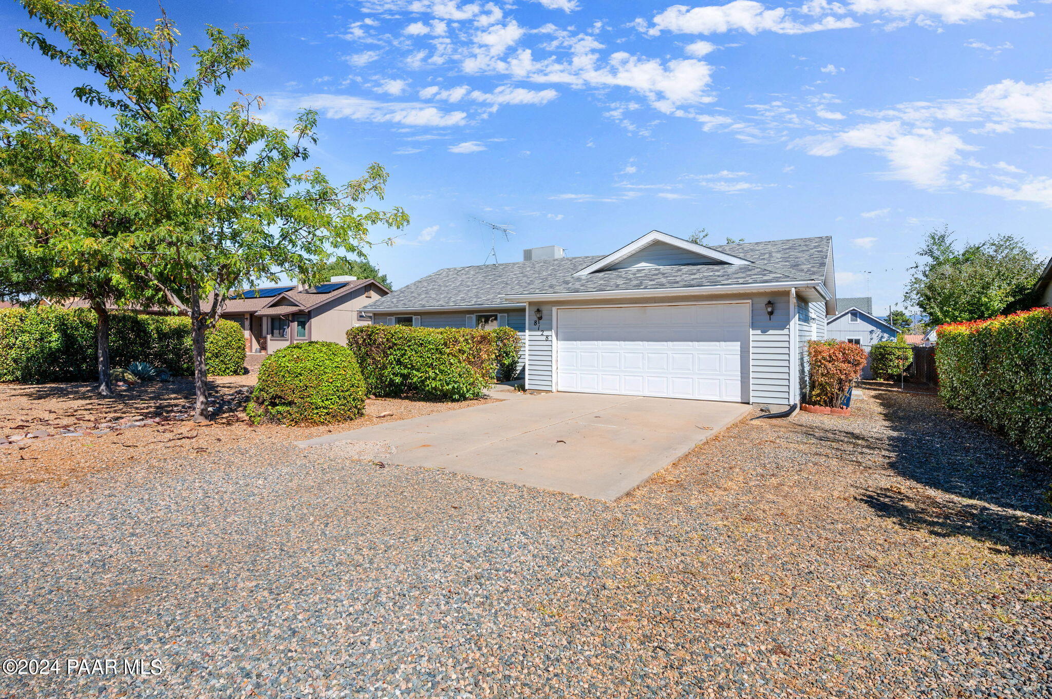 8128 East Gale Road Prescott Valley, AZ 86314 - Photo 6 of 38 a front view of a house with a yard and garage