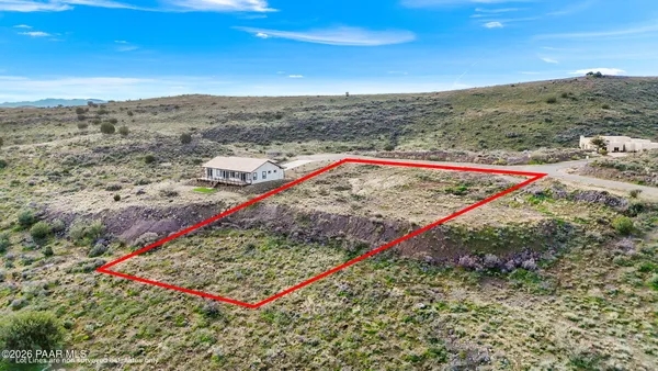 a view of a dry yard with mountain