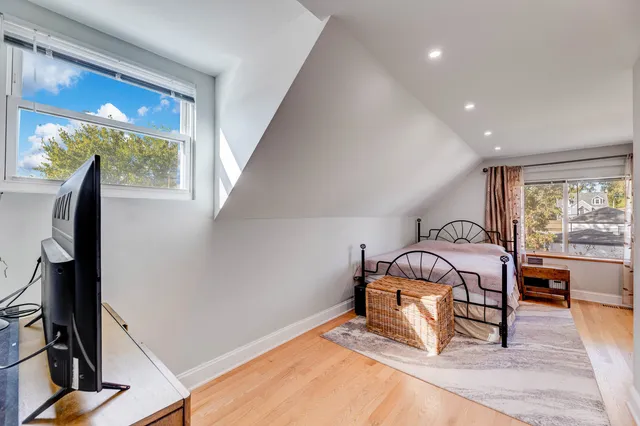 a bed room with a bed and a window