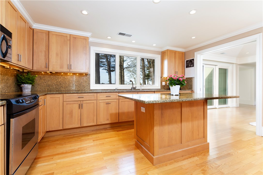 25 Pojac Point Road North Kingstown, RI 02852 - Photo 13 of 40 Well equipped kitchen featuring stainless steel appliances, granite counter-tops, center island, and plenty of cabinet storage!