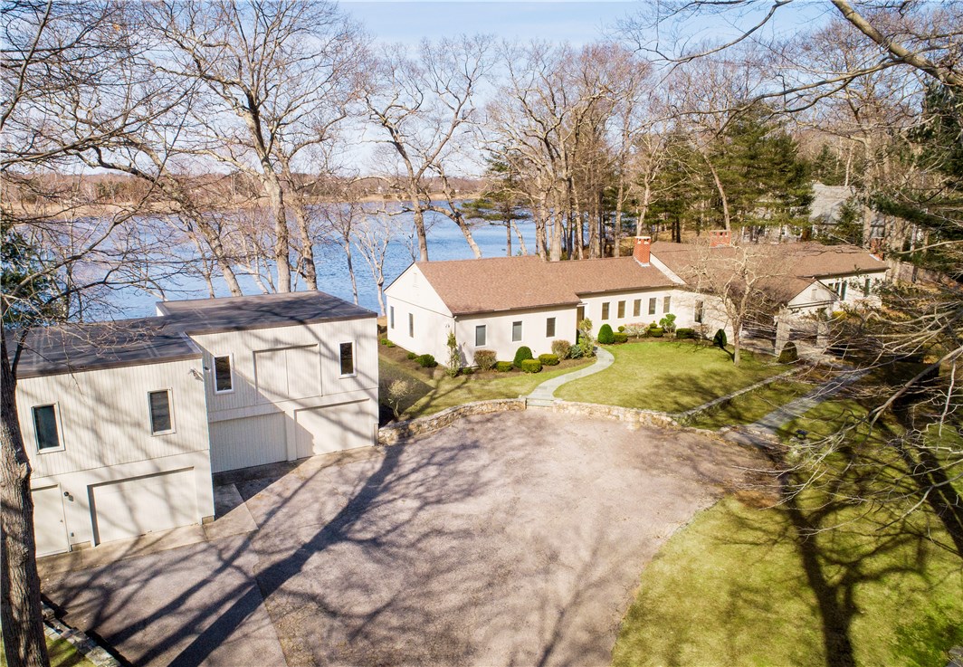 25 Pojac Point Road North Kingstown, RI 02852 - Photo 36 of 40 A detached 3 car garage with loft space offers endless possibilities...home office, studio apartment, art or yoga studio...it's up to you! Oh and yes this has water views too!