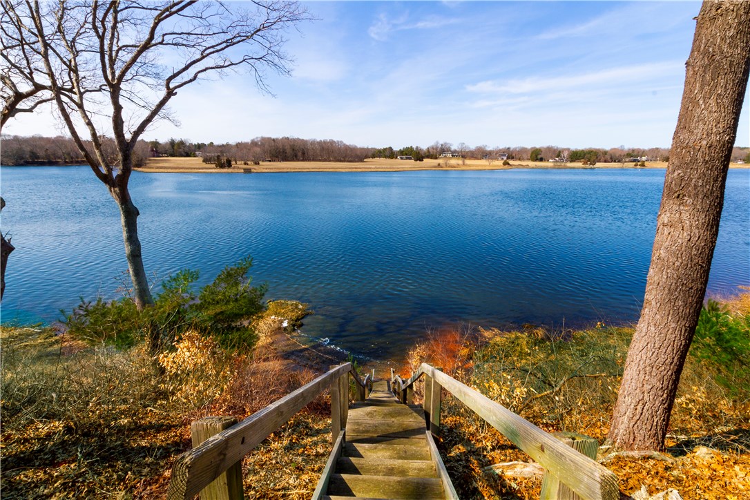 25 Pojac Point Road North Kingstown, RI 02852 - Photo 4 of 40 A private staircase leads to the Potowomut River...possibility for a mooring! Paddle your Kayak or launch a boat...make your way to Narragansett Bay!