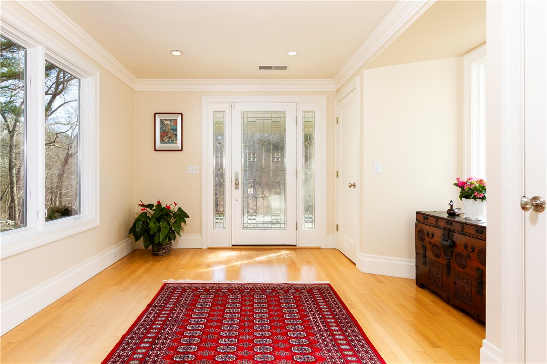 25 Pojac Point Road North Kingstown, RI 02852 - Photo 6 of 40 Light pours in from every window of this Foyer and offers 2 coat closets!