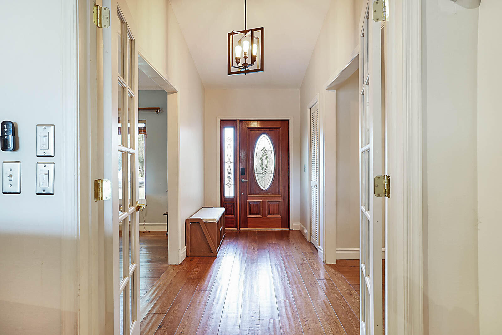 4422 Brandywine Drive Boca Raton, FL 33487 - Photo 1 of 18 a view of a hallway with wooden floor and furniture