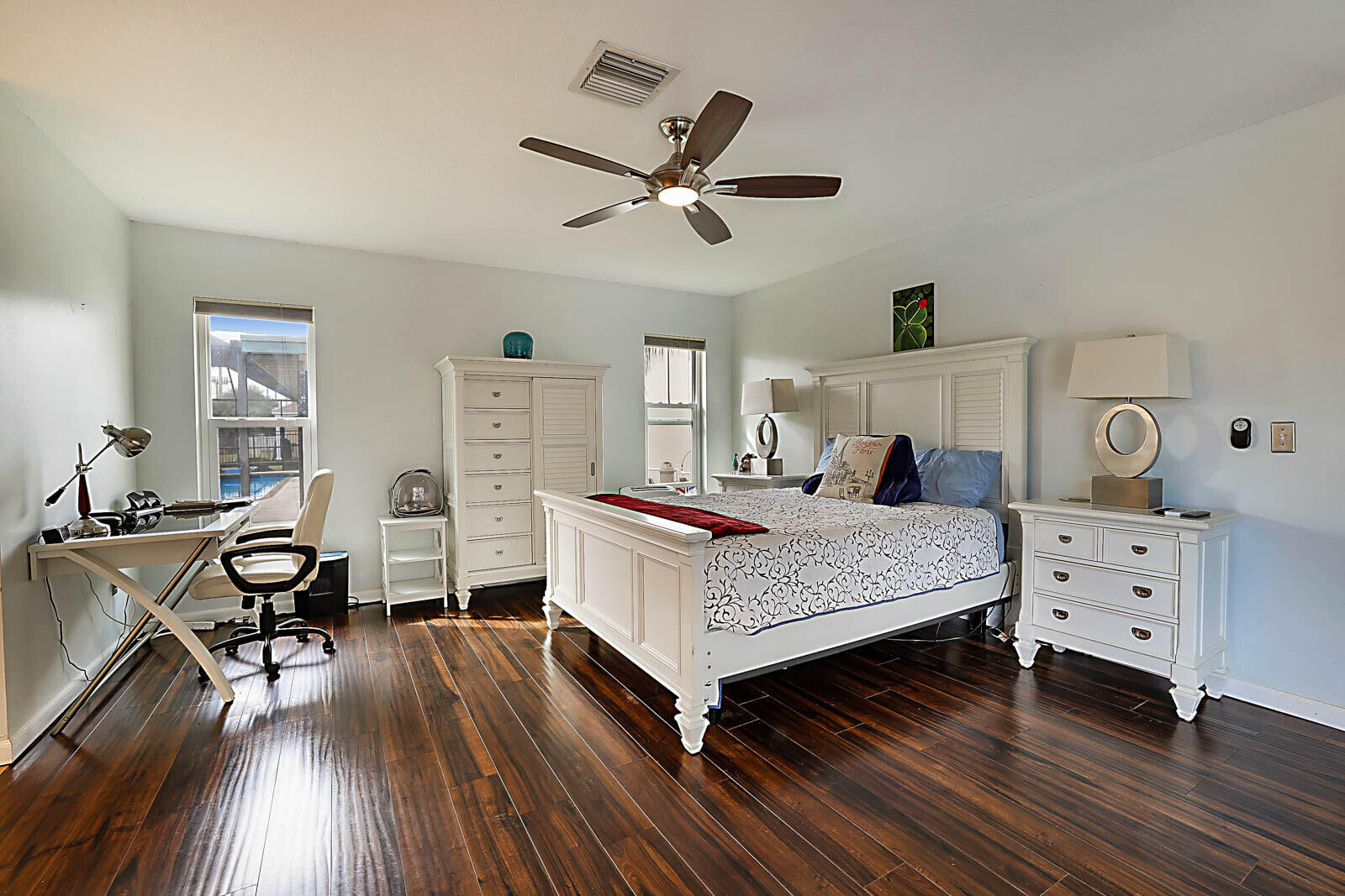 4422 Brandywine Drive Boca Raton, FL 33487 - Photo 11 of 18 a bedroom with a bed and wooden floor