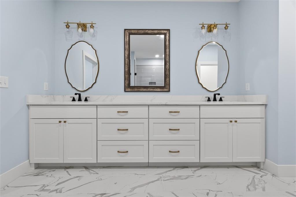 3528 North Bogan Road Buford, GA 30519 - Photo 70 of 79 a bathroom with a sink mirror and vanity