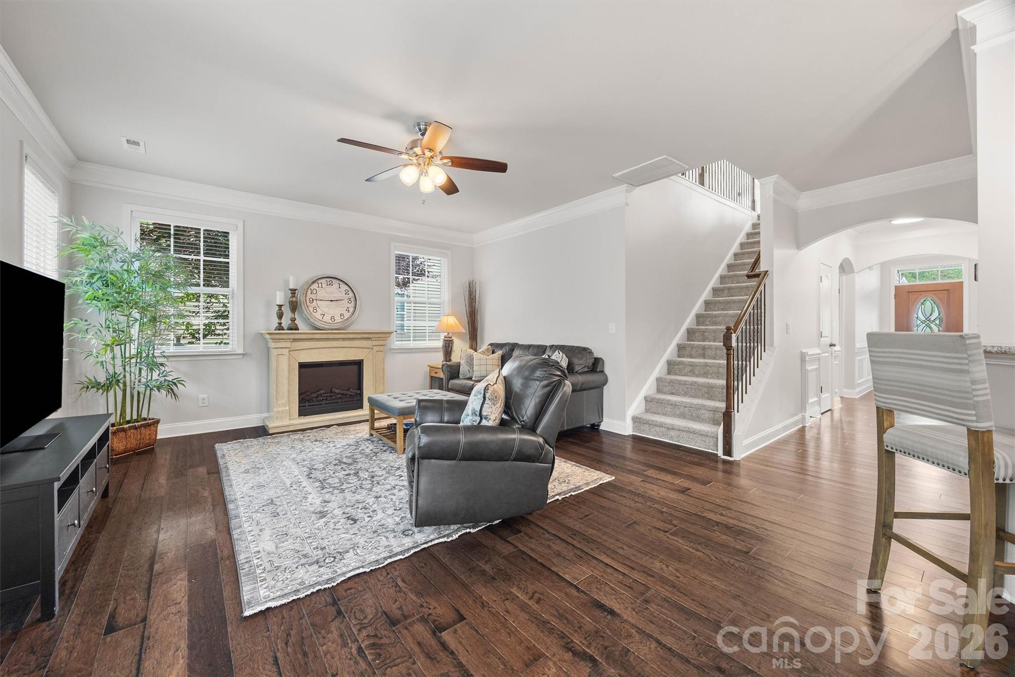 299 Annatto Way Tega Cay, SC 29708 - Photo 16 of 46 a living room with furniture a fireplace and a flat screen tv