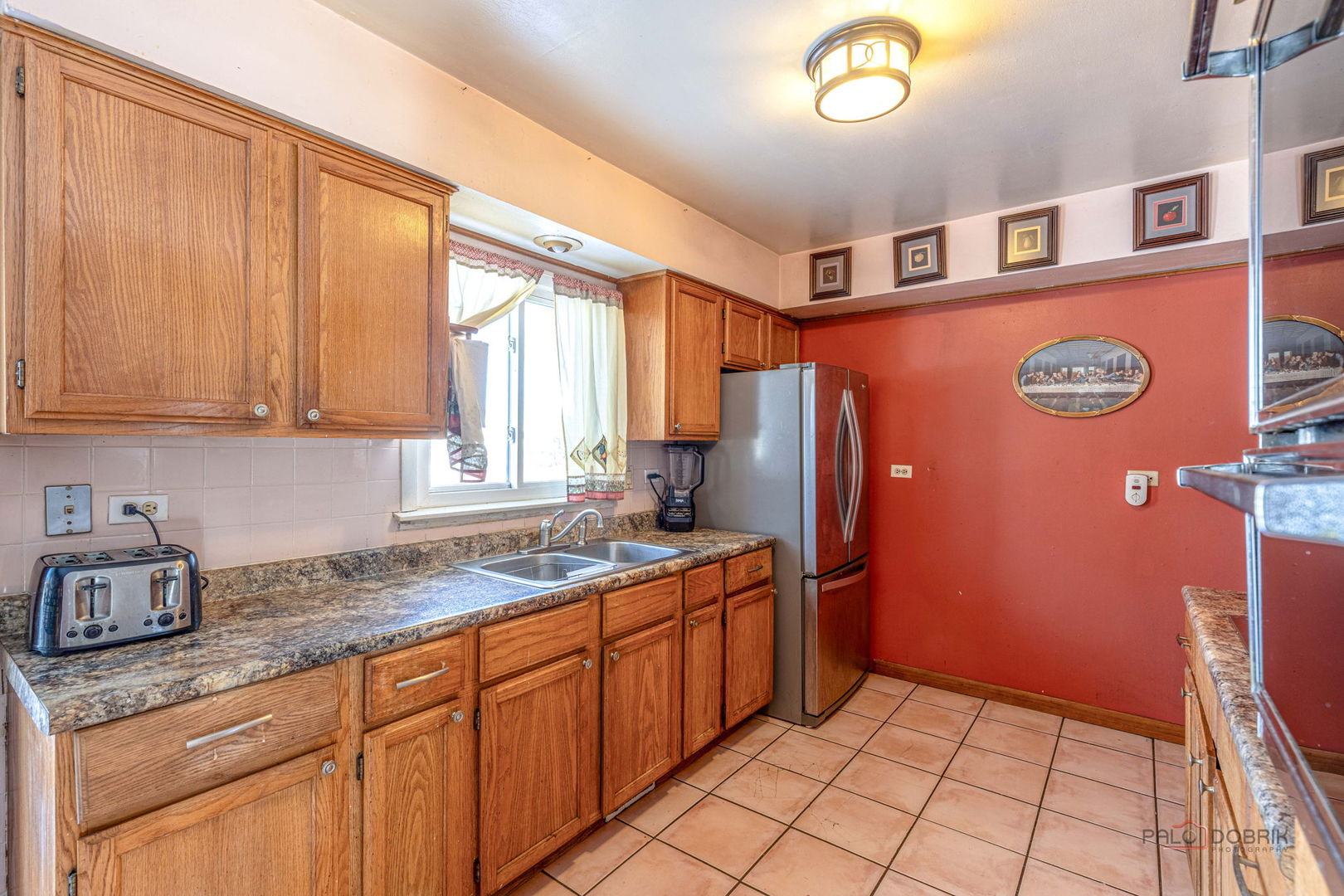 908 East Central Road Mount Prospect, IL 60056 - Photo 11 of 25 a kitchen with stainless steel appliances granite countertop a refrigerator and a sink