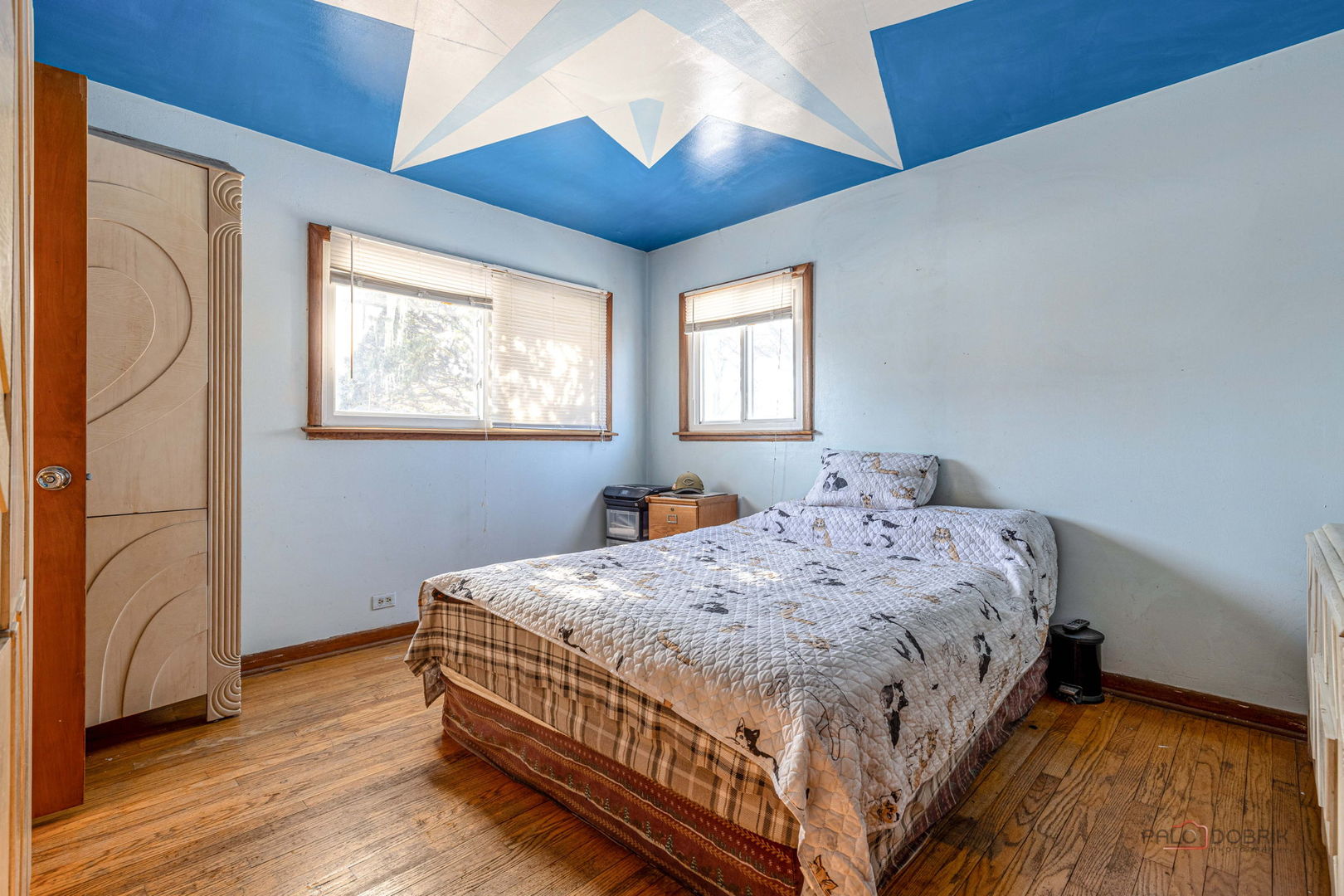 908 East Central Road Mount Prospect, IL 60056 - Photo 14 of 25 a bedroom with a bed and wooden floor