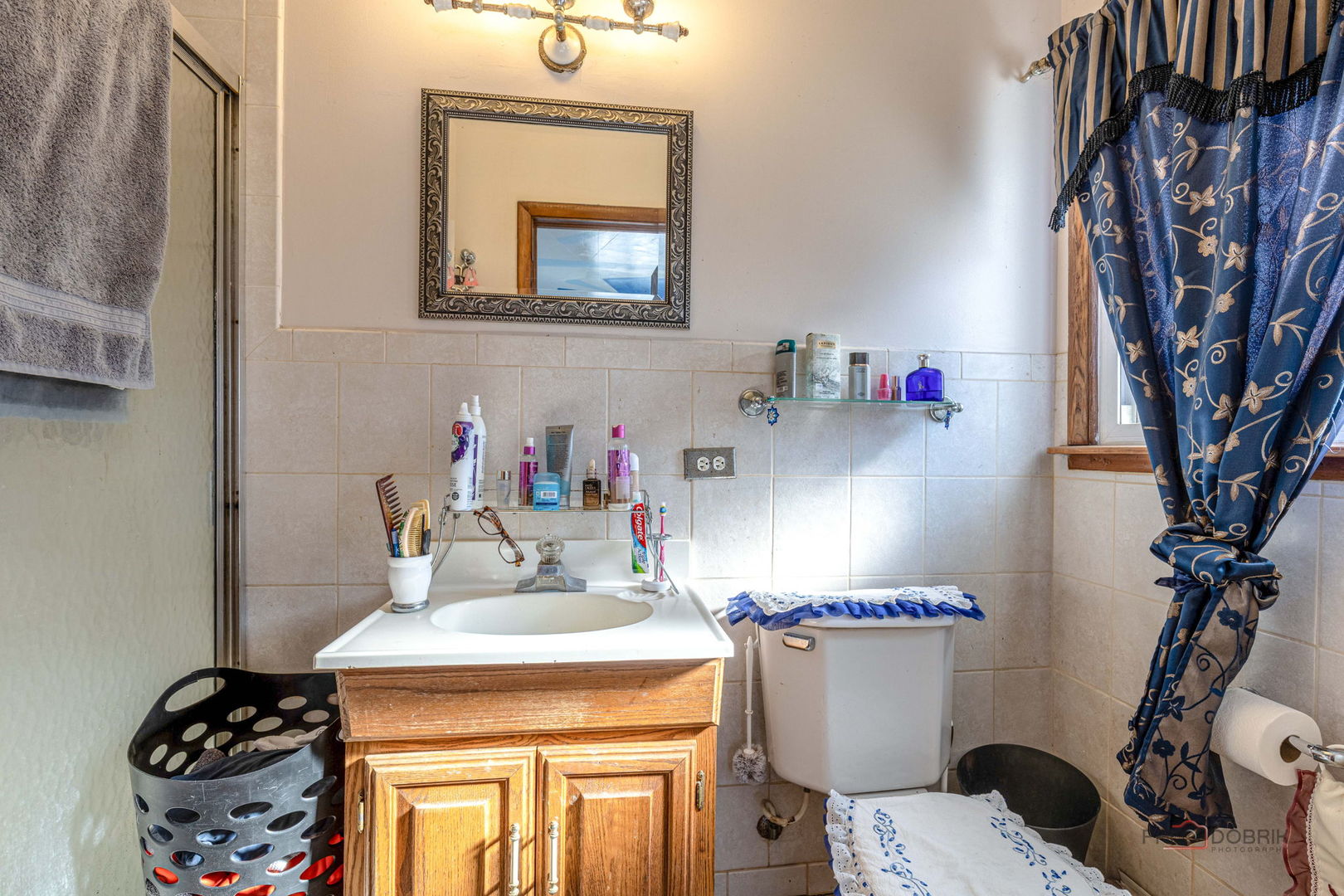 908 East Central Road Mount Prospect, IL 60056 - Photo 15 of 25 a bathroom with a sink toilet and a mirror