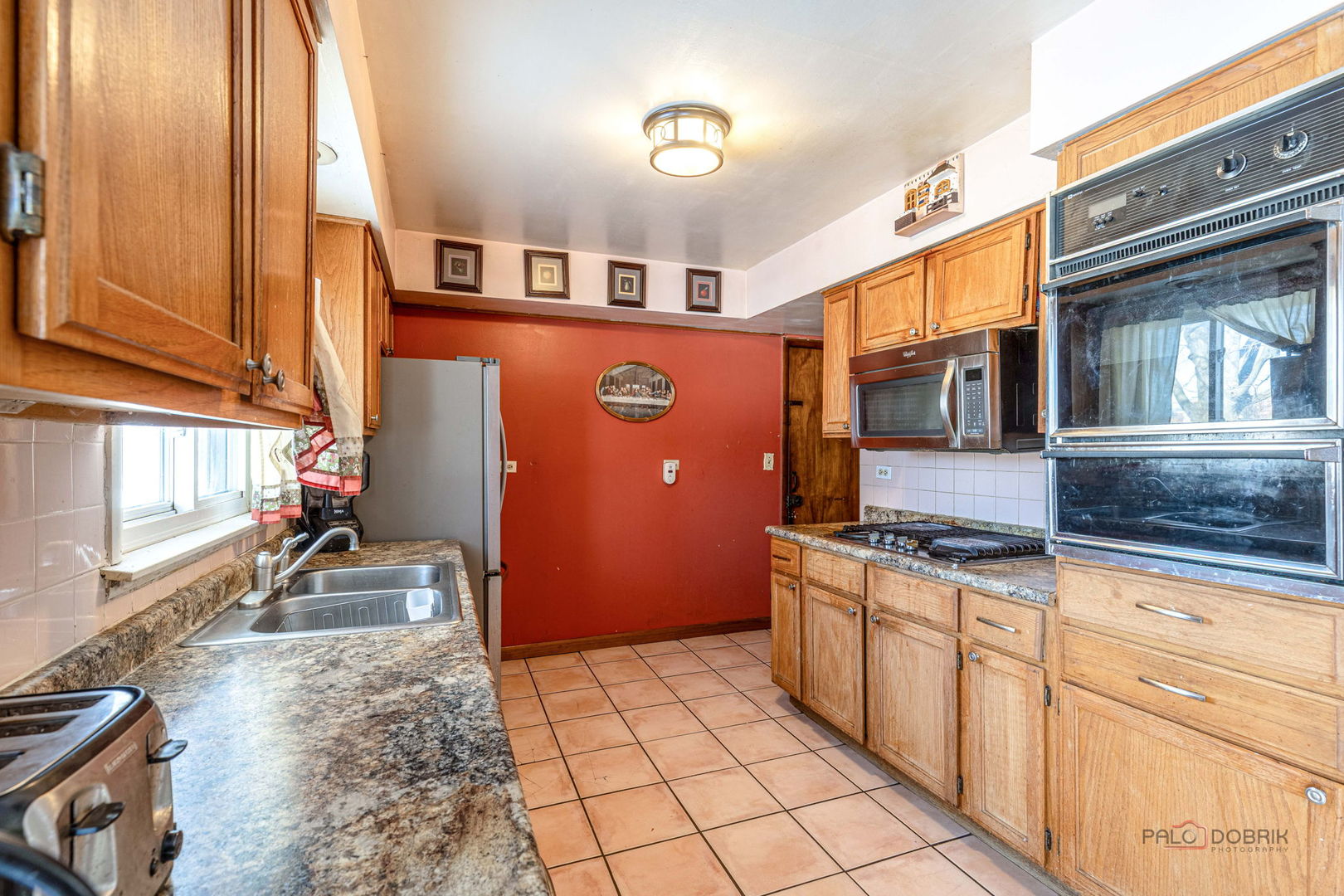908 East Central Road Mount Prospect, IL 60056 - Photo 10 of 25 a kitchen with stainless steel appliances granite countertop a stove and a sink