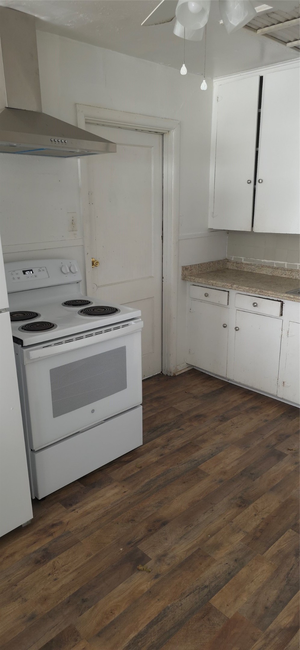 2811 Iola Street, Unit 8 Houston, TX 77017 - Photo 11 of 12 a kitchen with a stove oven and white cabinets