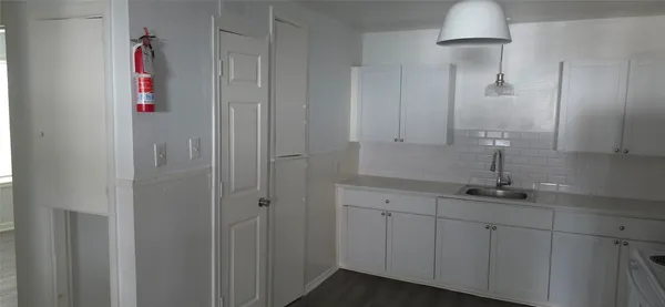 a bathroom with a sink and mirror