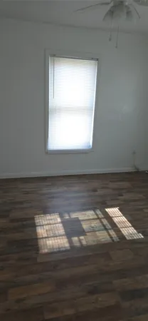 a view of lot of wooden floor and window