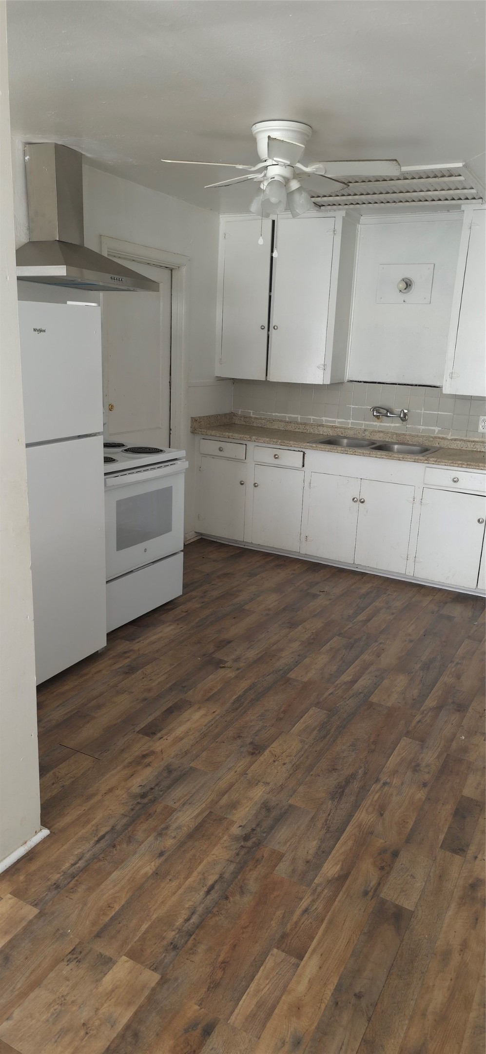 2811 Iola Street, Unit 8 Houston, TX 77017 - Photo 7 of 12 a kitchen with granite countertop a refrigerator and a stove top oven