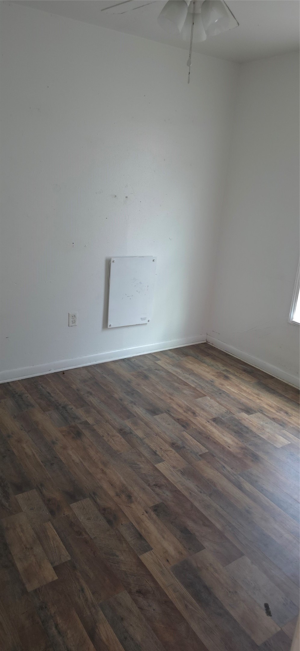 2811 Iola Street, Unit 8 Houston, TX 77017 - Photo 8 of 12 a view of an empty room with wooden floor and a window