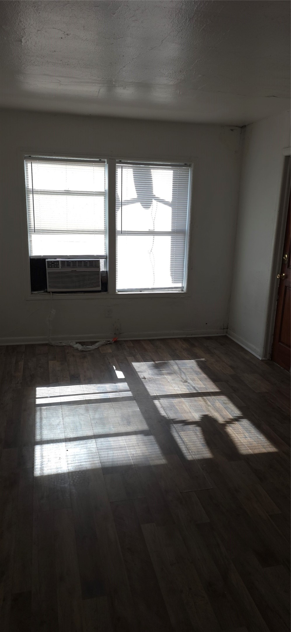 2811 Iola Street, Unit 8 Houston, TX 77017 - Photo 10 of 12 a view of empty room with wooden floor and a window