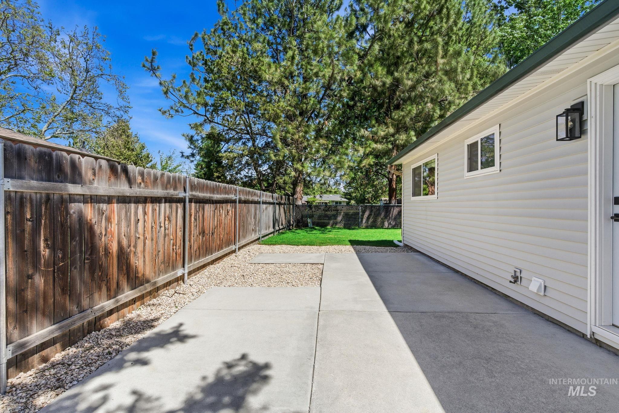 2224 Rachel Circle Boise, ID 83706 - Photo 41 of 50 Siding exterior with multiple windows and an outdoor light fixture