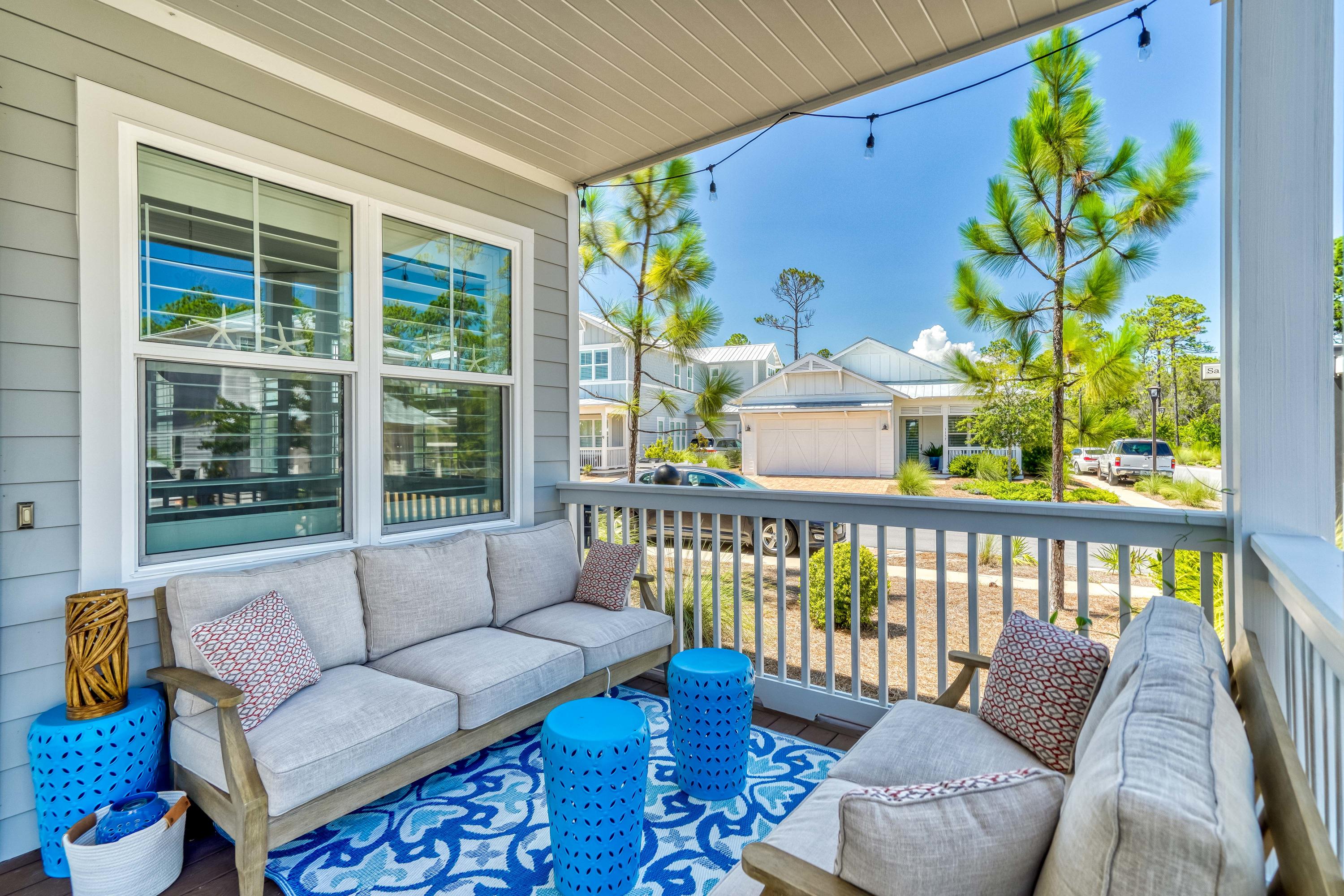 117 Prairie Pass Santa Rosa Beach, FL 32459 - Photo 23 of 26 a balcony with furniture and a potted plant