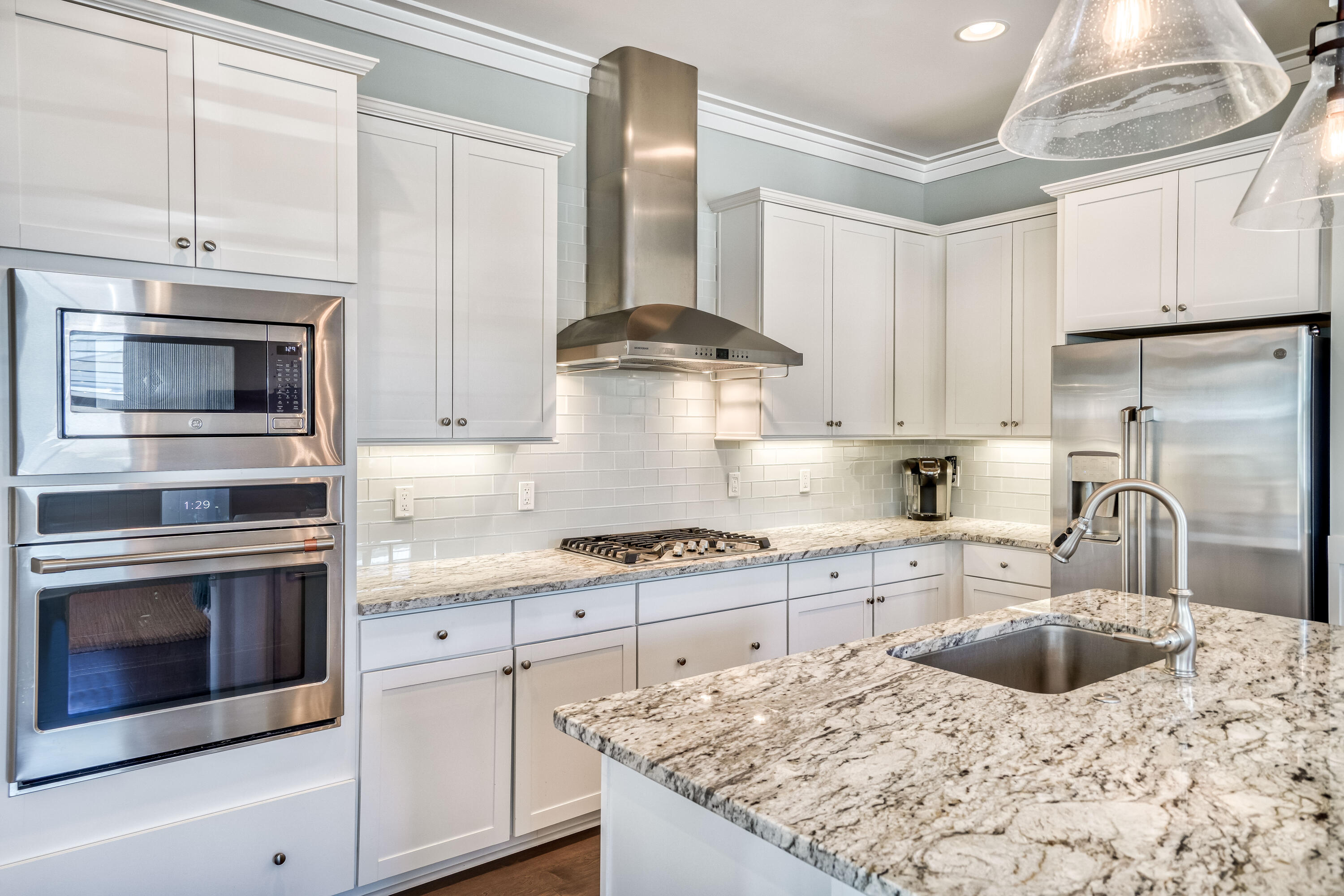 117 Prairie Pass Santa Rosa Beach, FL 32459 - Photo 8 of 26 a kitchen with stainless steel appliances granite countertop a sink stove and refrigerator