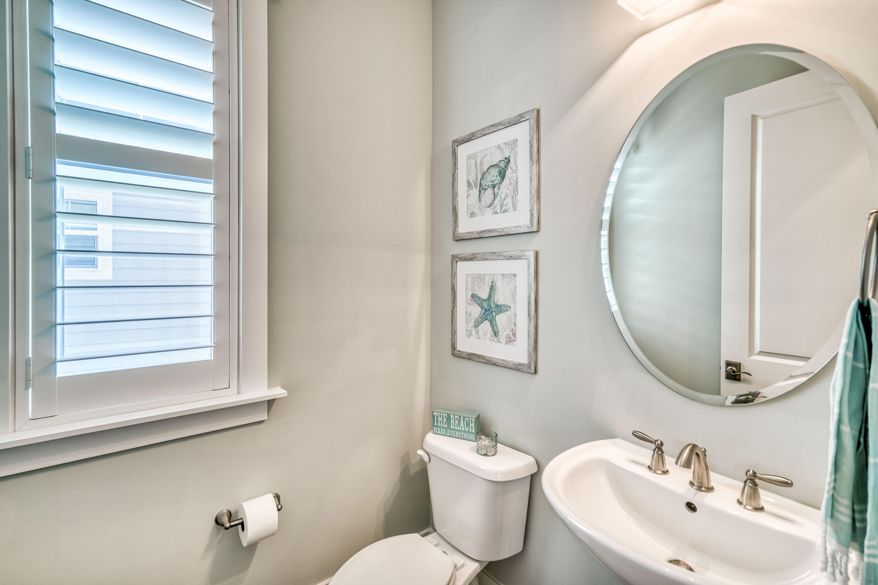 117 Prairie Pass Santa Rosa Beach, FL 32459 - Photo 9 of 26 a bathroom with a toilet sink and mirror