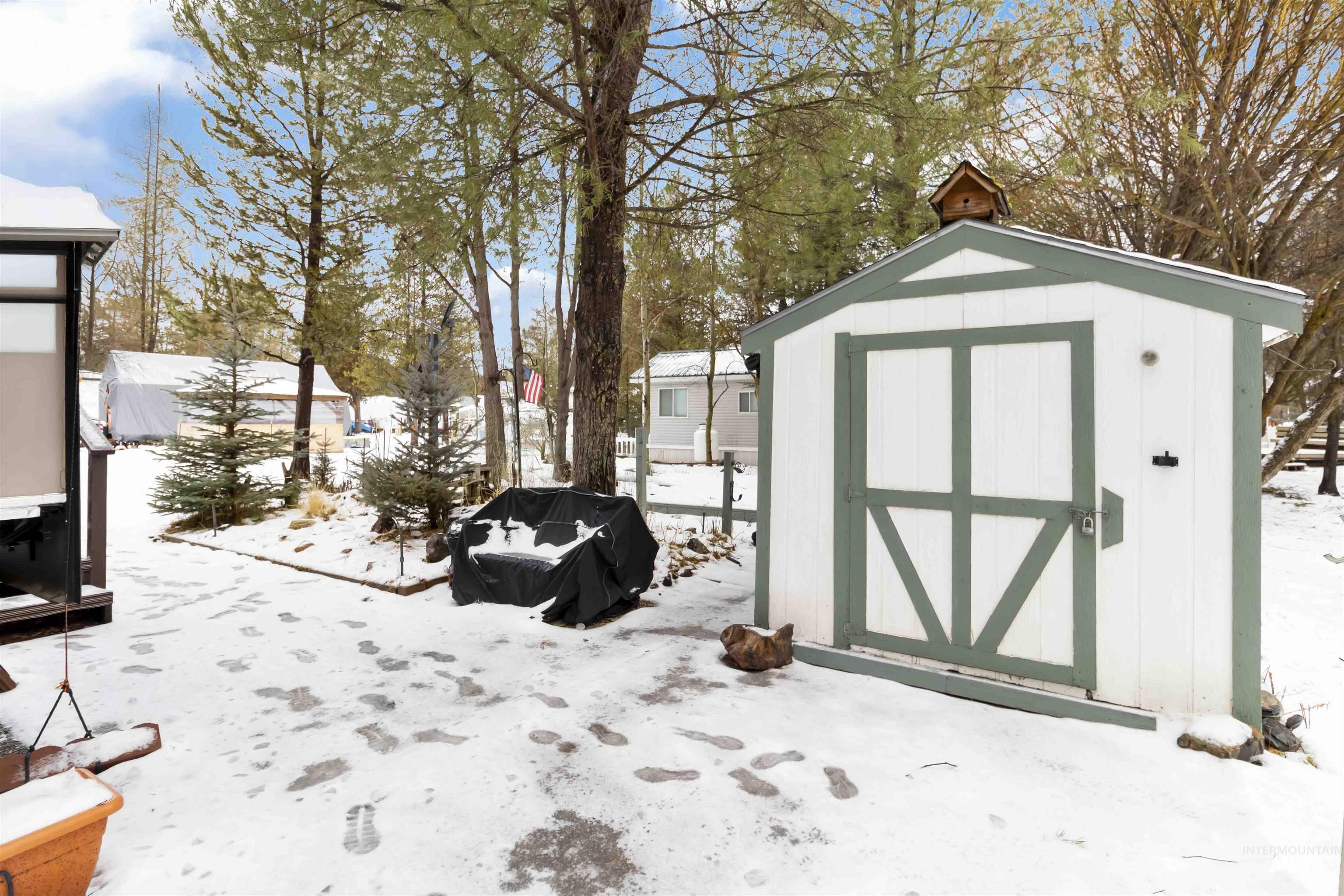 H05 North Sawyer Street Cascade, ID 83611 - Photo 22 of 40 Snow covered structure with a storage shed