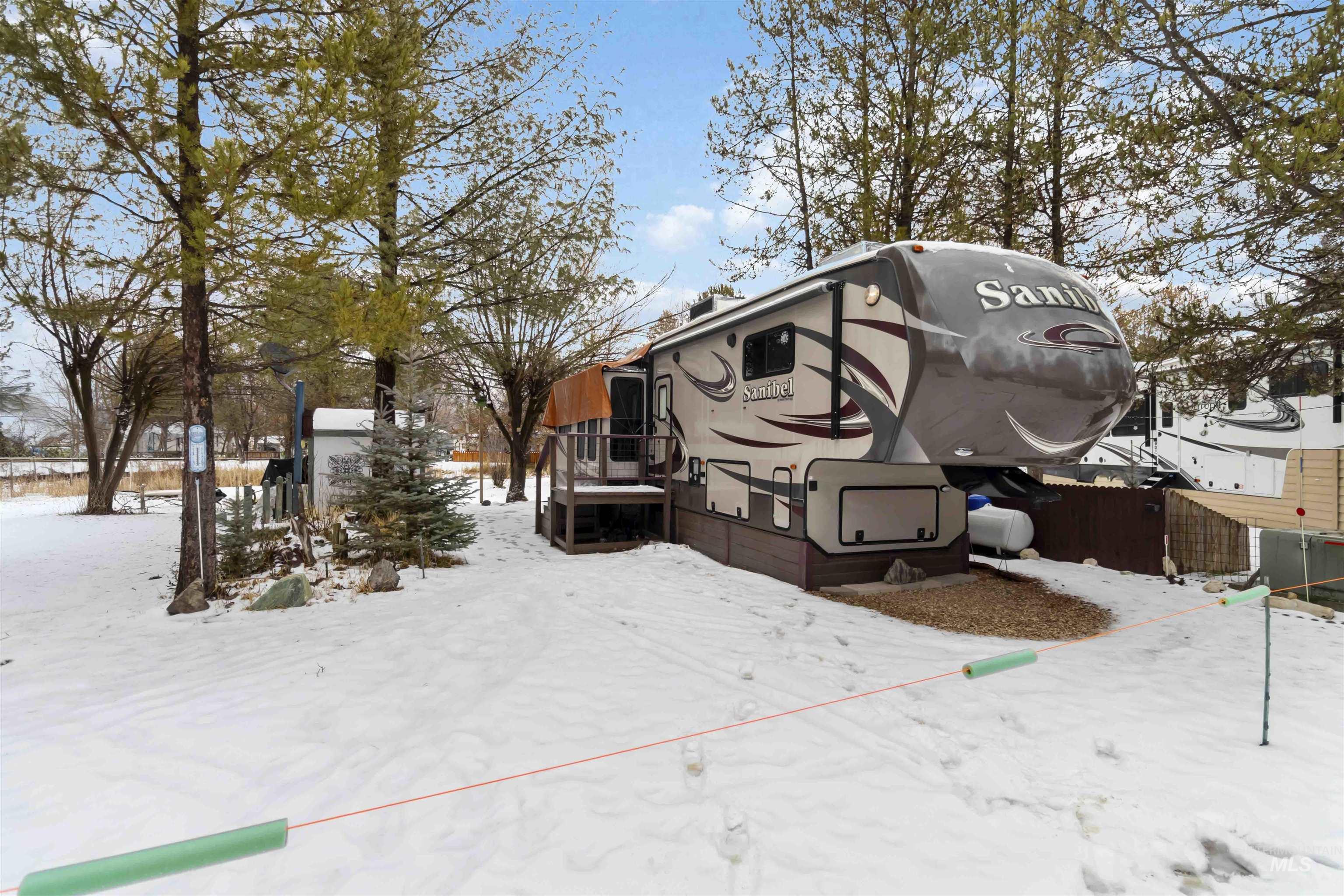 H05 North Sawyer Street Cascade, ID 83611 - Photo 5 of 40 View of snow covered exterior with a wooden deck