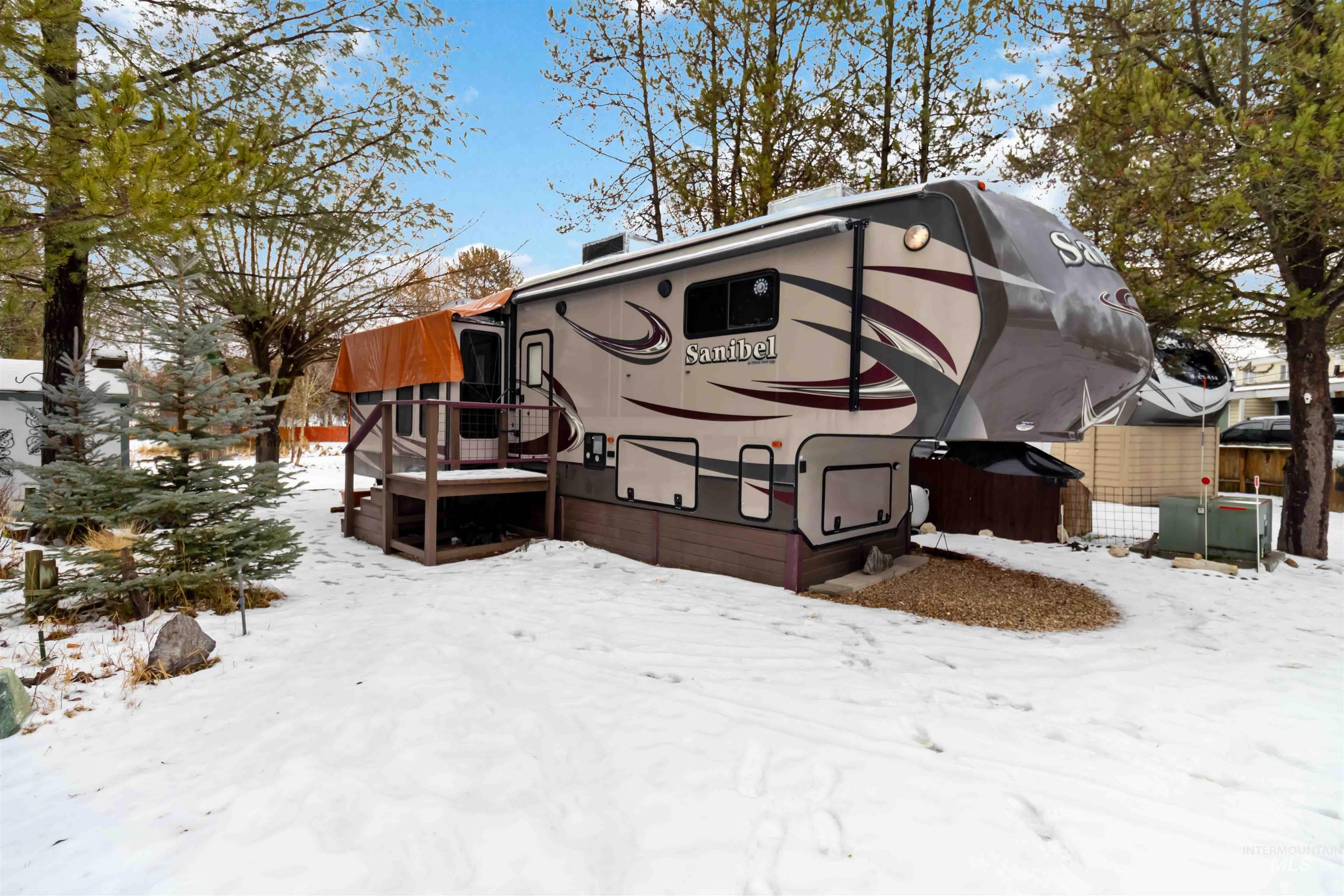 H05 North Sawyer Street Cascade, ID 83611 - Photo 7 of 40 View of snow covered exterior featuring a deck