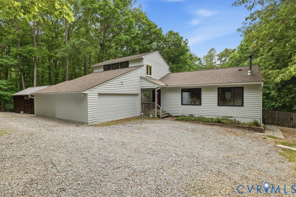 1061 Turkey Ridge Drive Moseley, VA 23120 - Photo 1 of 51 a house that has a tree in front of it