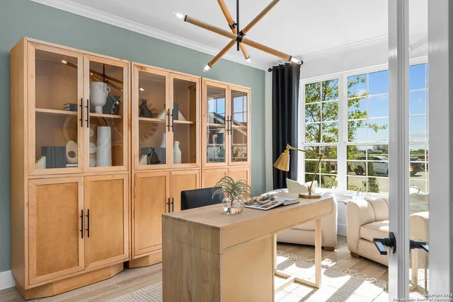 a dining room with a large window and couch