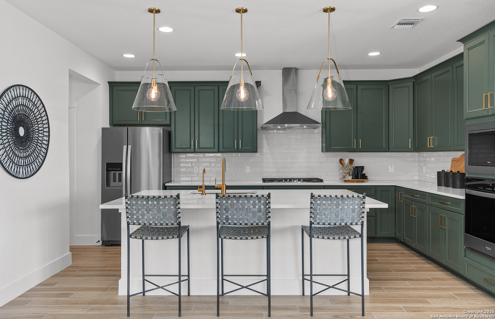 205 Farming Grove Boerne, TX 78006 - Photo 9 of 27 a kitchen with stainless steel appliances granite countertop a kitchen island a stove and a refrigerator