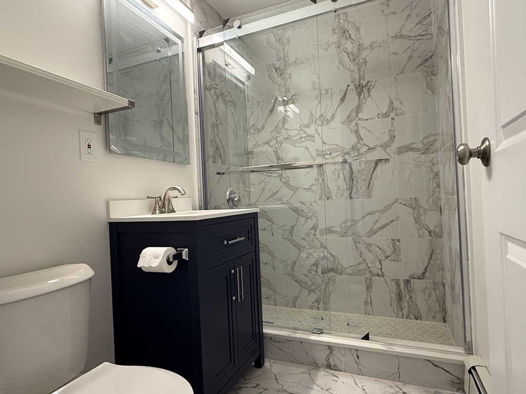 100 Grandview Avenue, Unit 14B Quincy, MA 02170 - Photo 6 of 9 a bathroom with a toilet and a shower