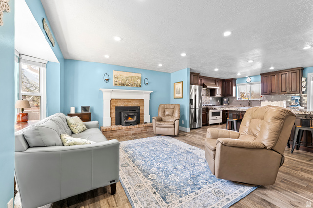 141 North 600 East Mapleton, UT 84664 - Photo 4 of 44 Living room with recessed lighting, light wood finished floors, and a textured ceiling
