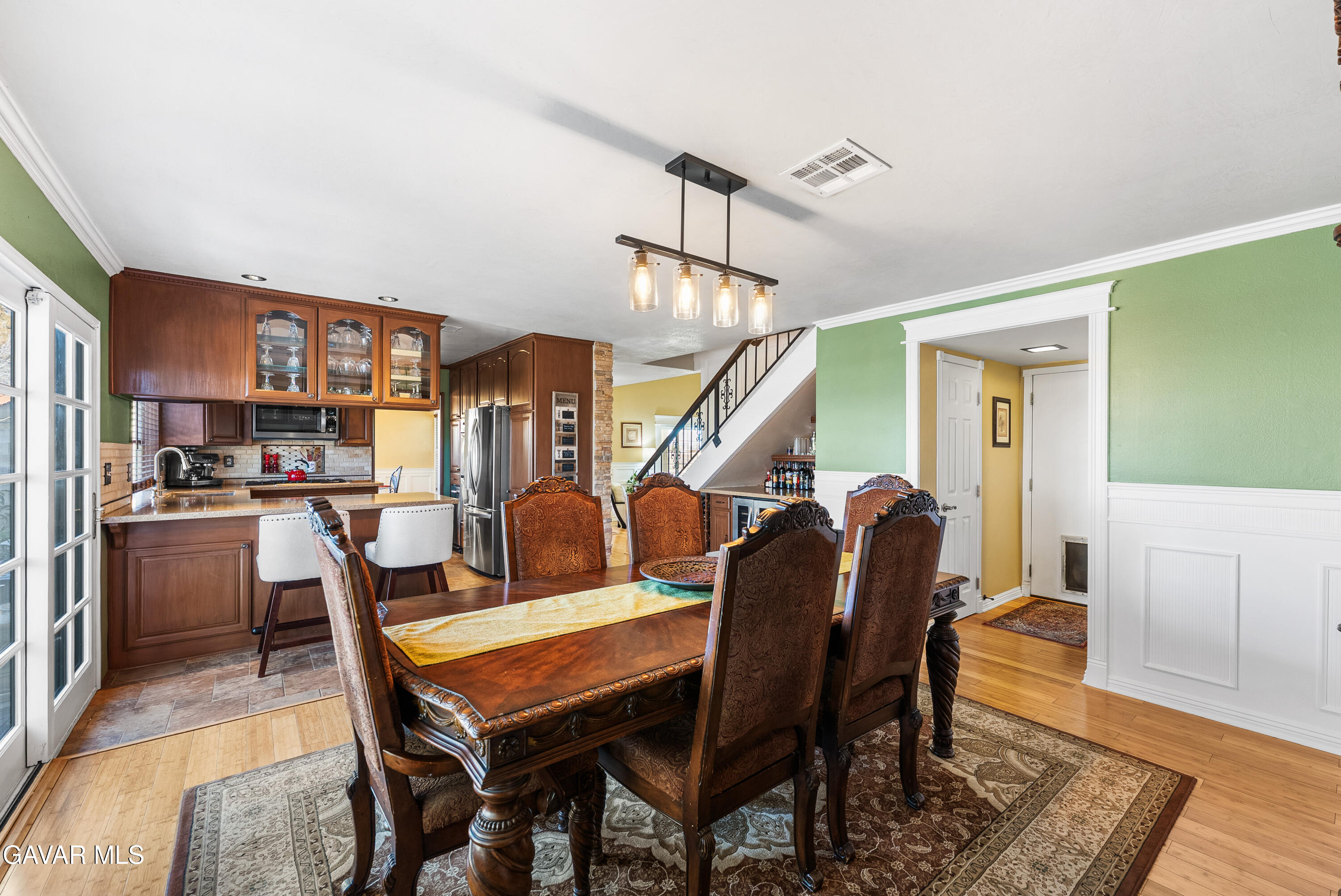 44003 7th Street East Lancaster, CA 93535 - Photo 19 of 62 a dining room with furniture and wooden floor