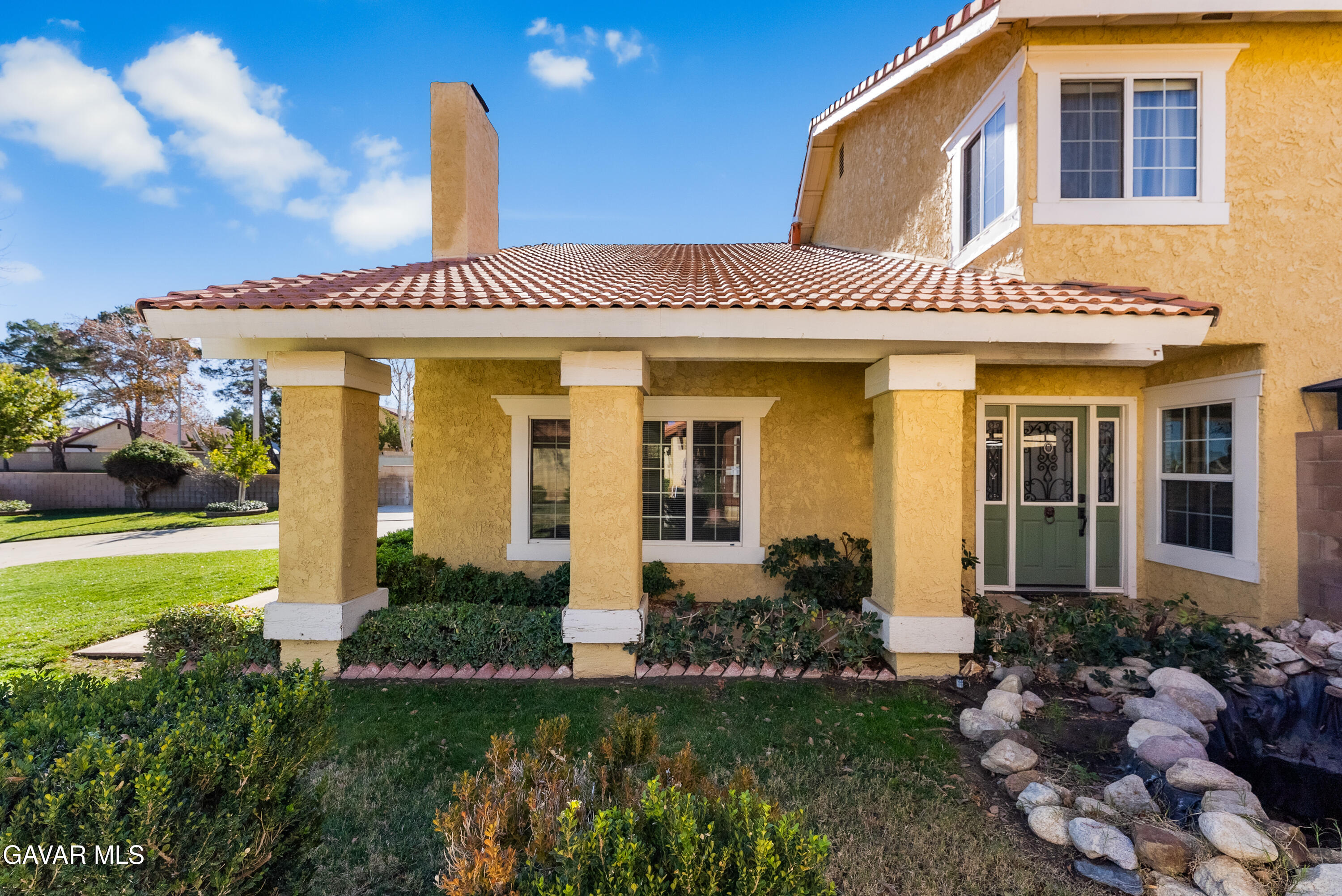 44003 7th Street East Lancaster, CA 93535 - Photo 21 of 62 a front view of a house with a yard