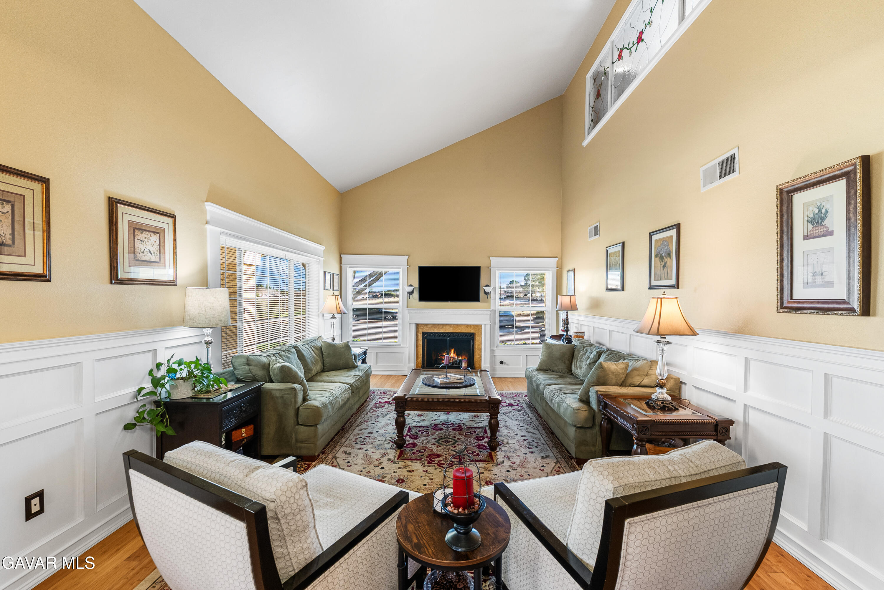 44003 7th Street East Lancaster, CA 93535 - Photo 24 of 62 a living room with furniture potted plant and a fireplace