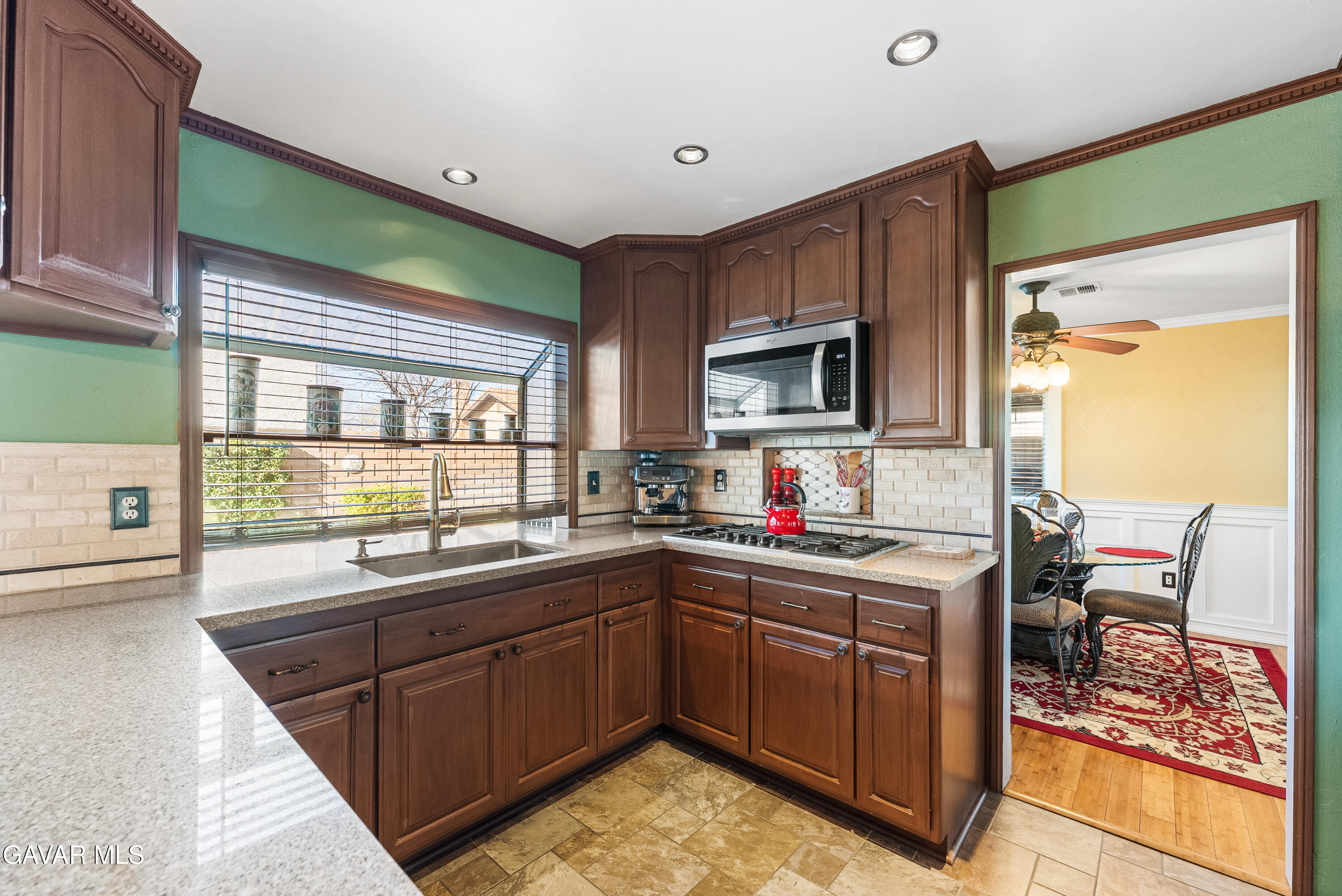 44003 7th Street East Lancaster, CA 93535 - Photo 25 of 62 a kitchen with a sink a counter top space and cabinets