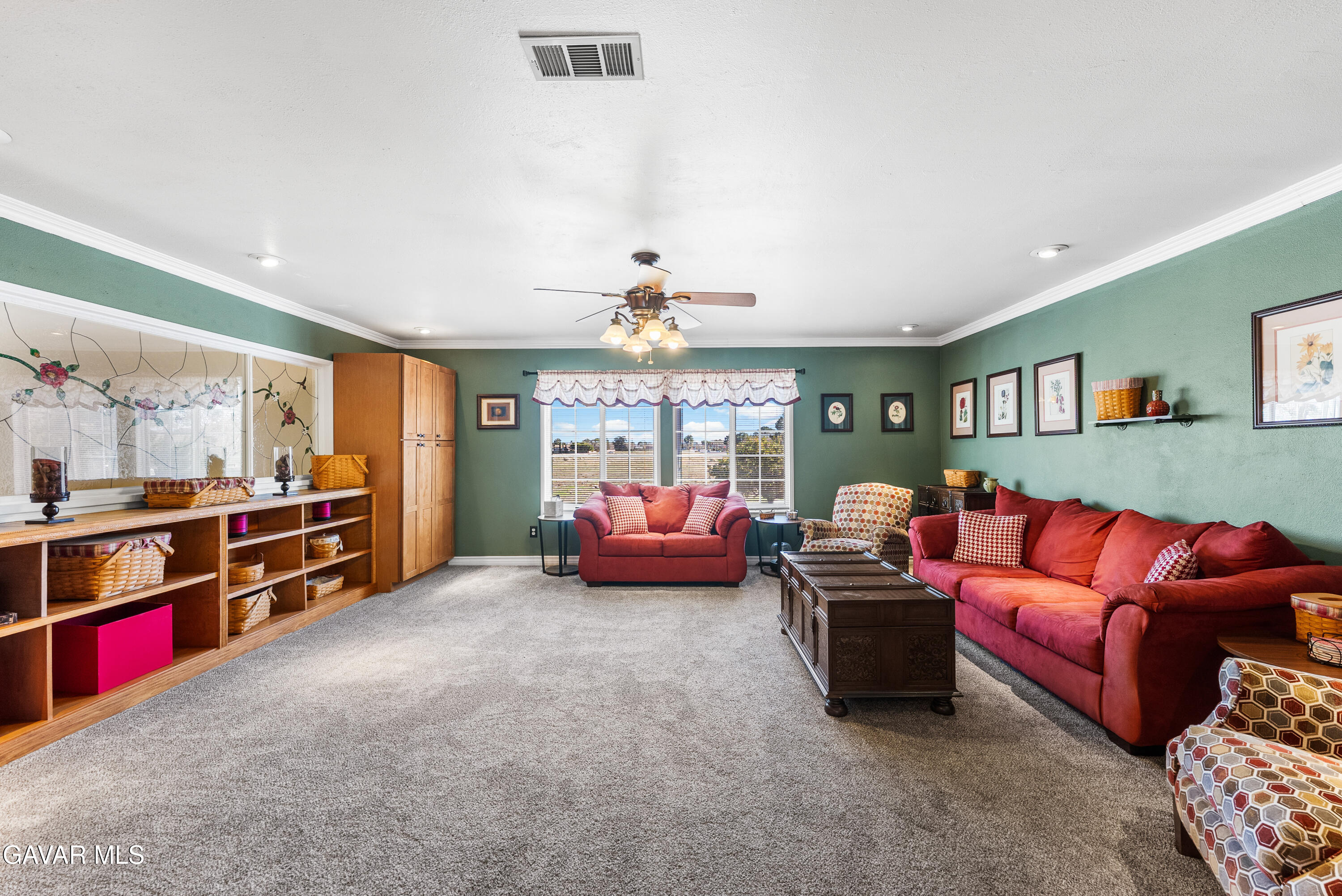 44003 7th Street East Lancaster, CA 93535 - Photo 29 of 62 a living room with furniture and a flat screen tv
