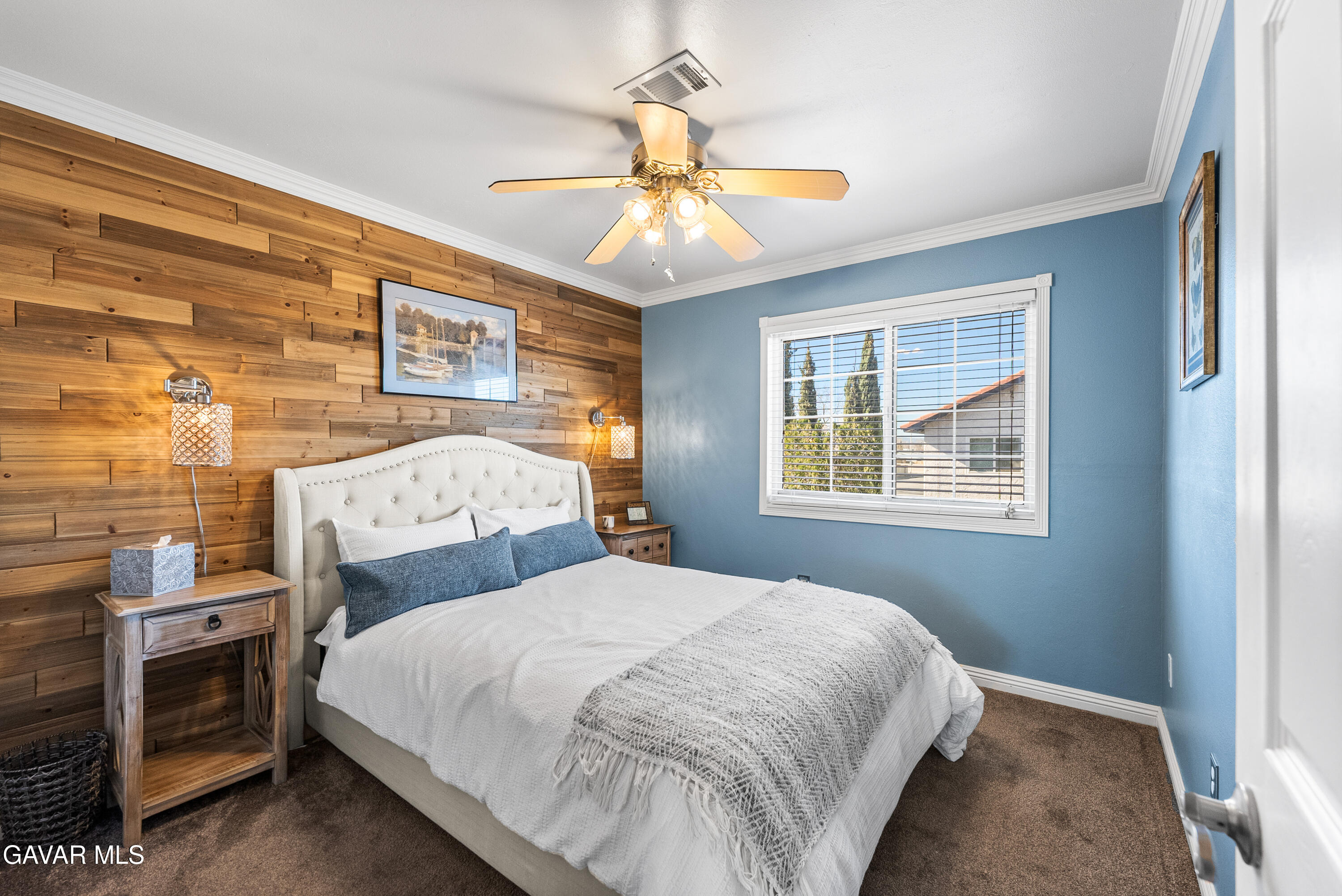 44003 7th Street East Lancaster, CA 93535 - Photo 33 of 62 a bedroom with a bed and a chandelier