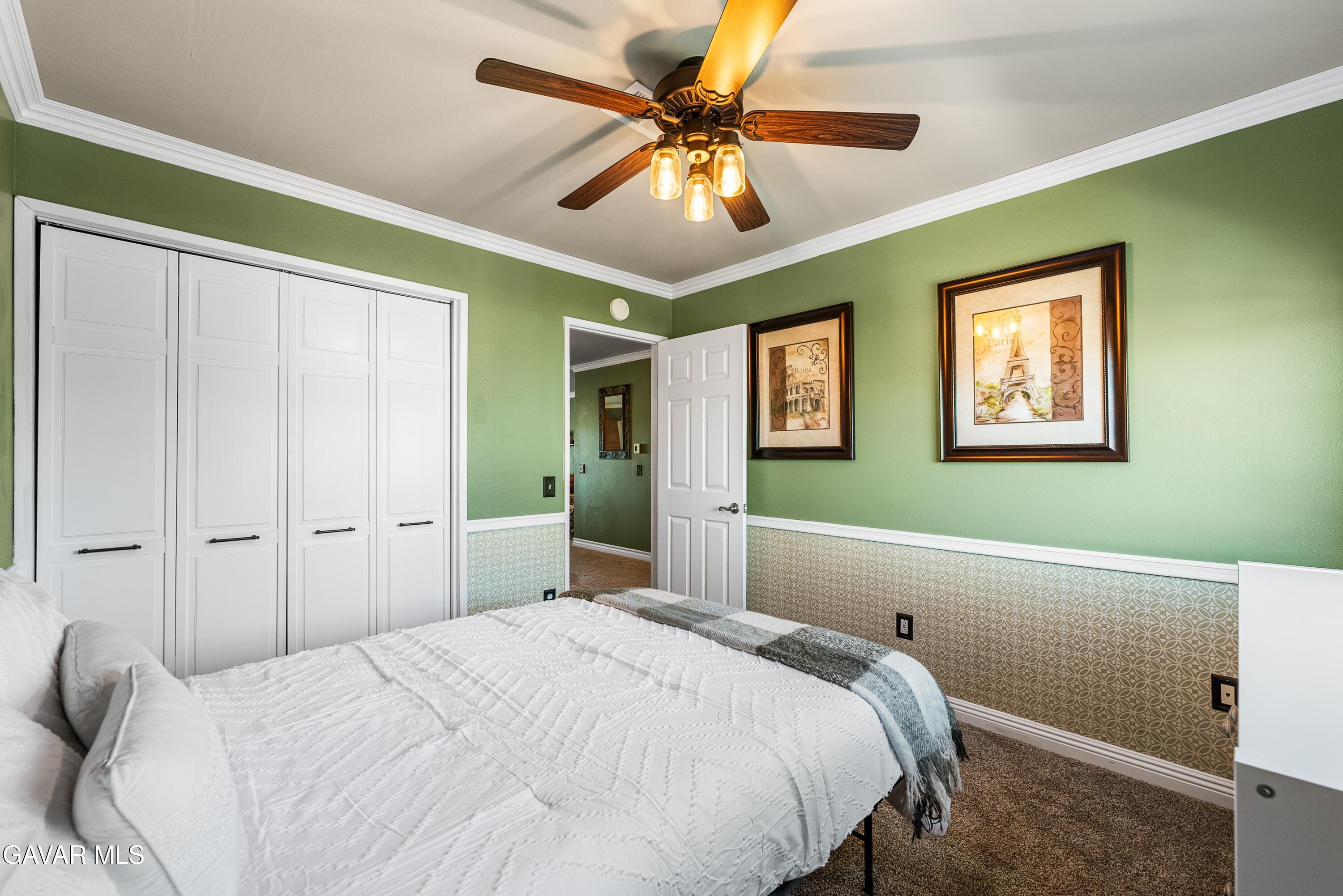 44003 7th Street East Lancaster, CA 93535 - Photo 36 of 62 a bedroom with a bed and a chandelier