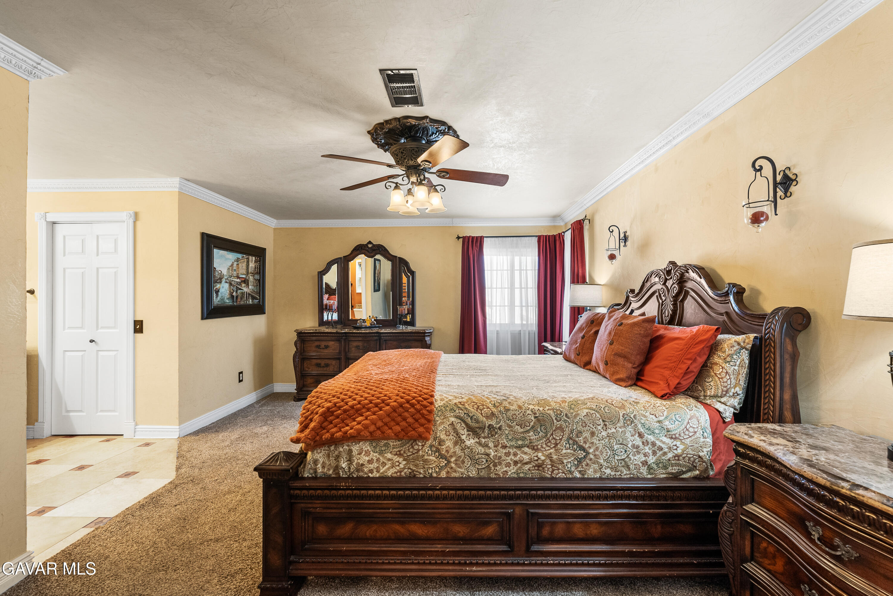 44003 7th Street East Lancaster, CA 93535 - Photo 38 of 62 a bedroom with a bed and dresser with mirror