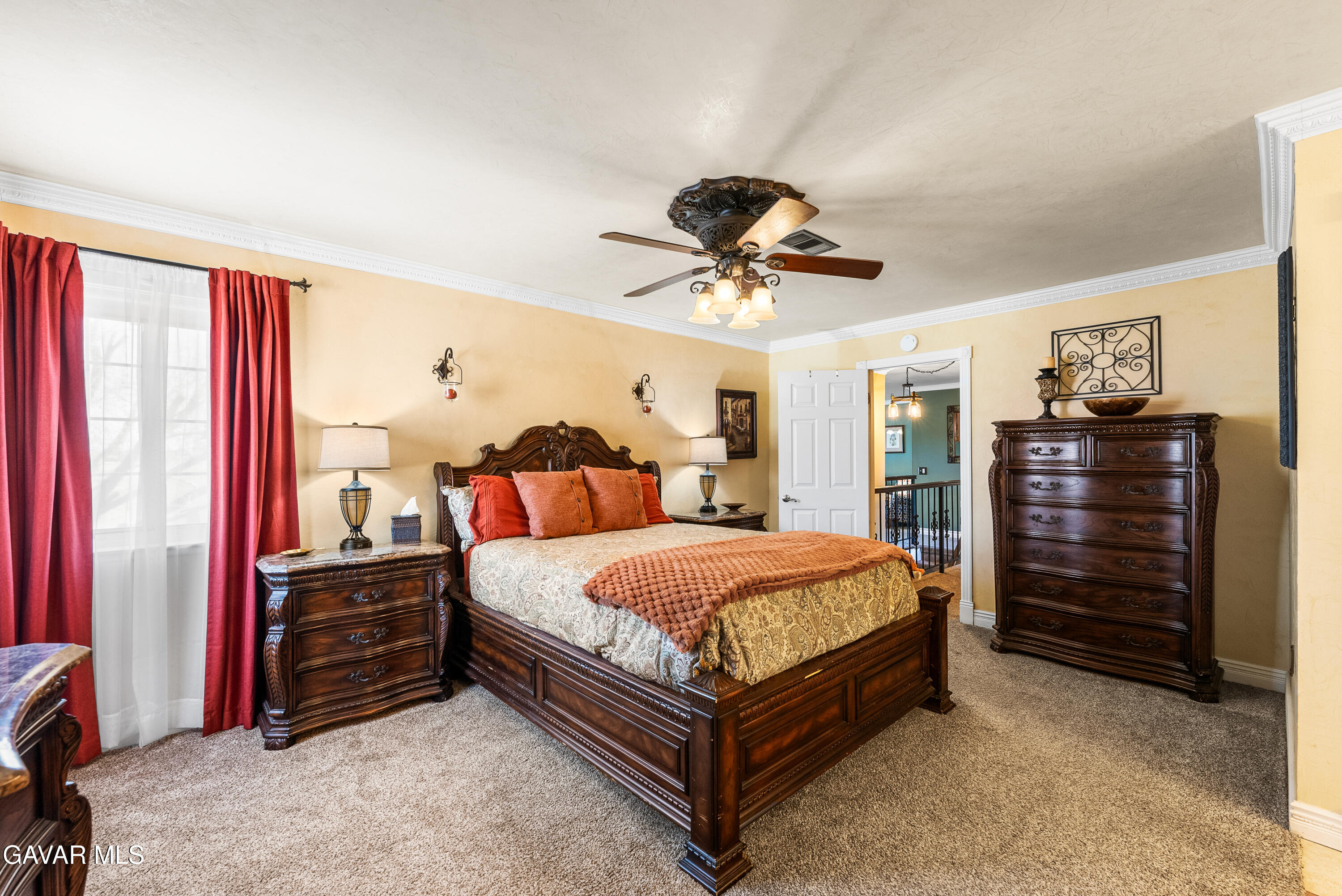 44003 7th Street East Lancaster, CA 93535 - Photo 40 of 62 a bedroom with a bed chandelier and dresser