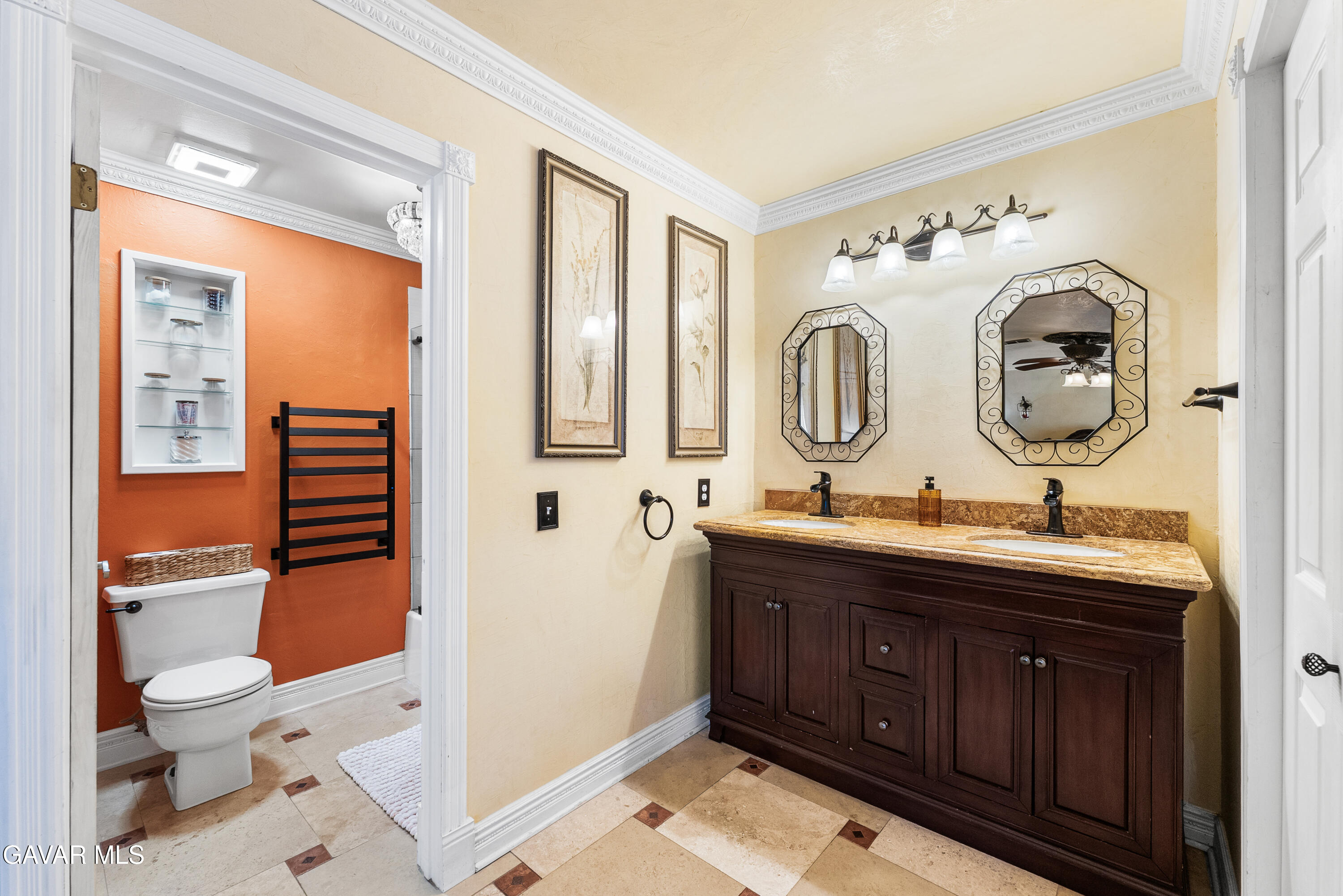 44003 7th Street East Lancaster, CA 93535 - Photo 41 of 62 a bathroom with a toilet a sink and a mirror